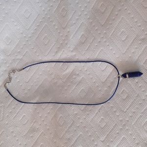 Dark blue bullet pendant.